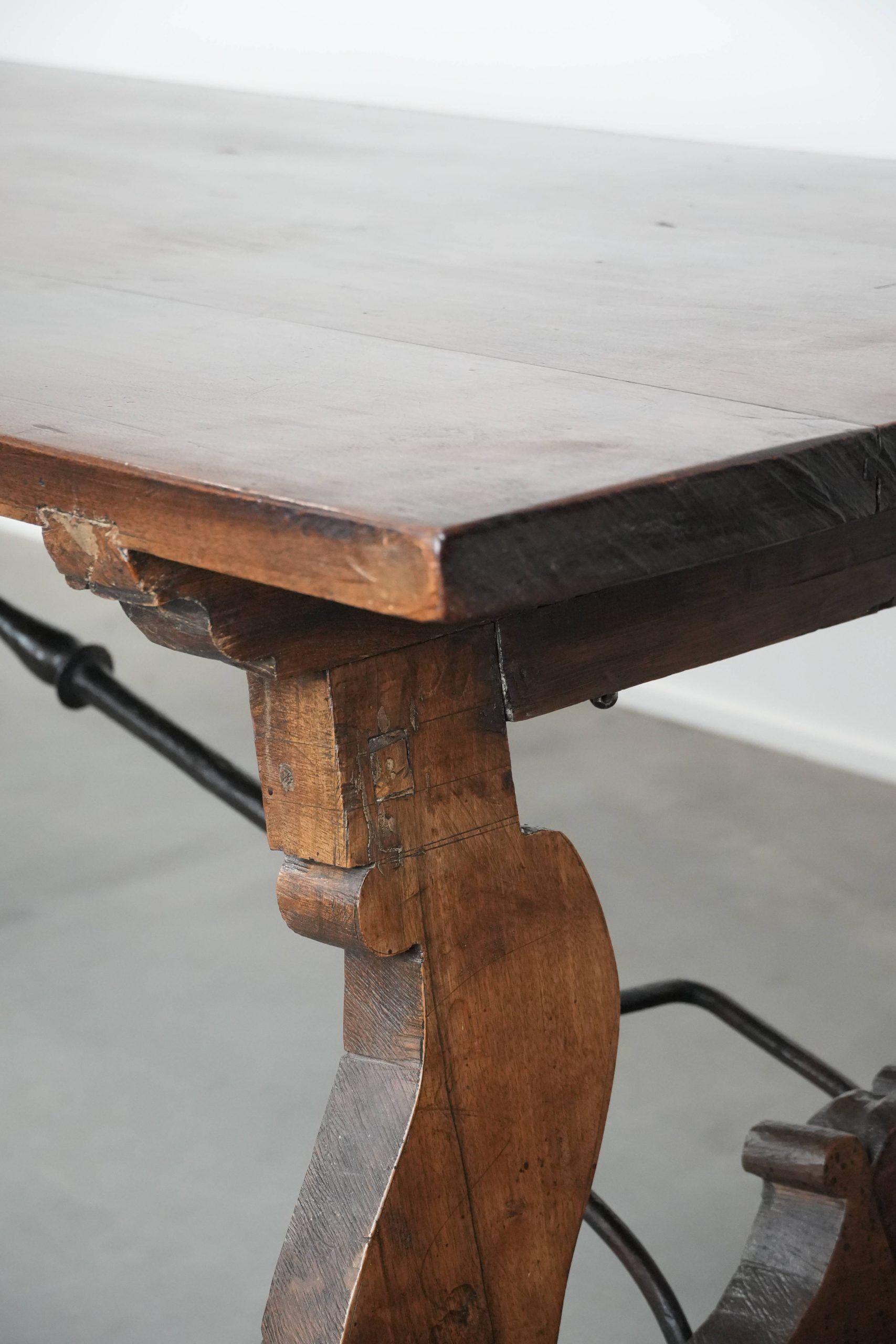 Antique 18th-century Spanish dining table with a wrought iron base