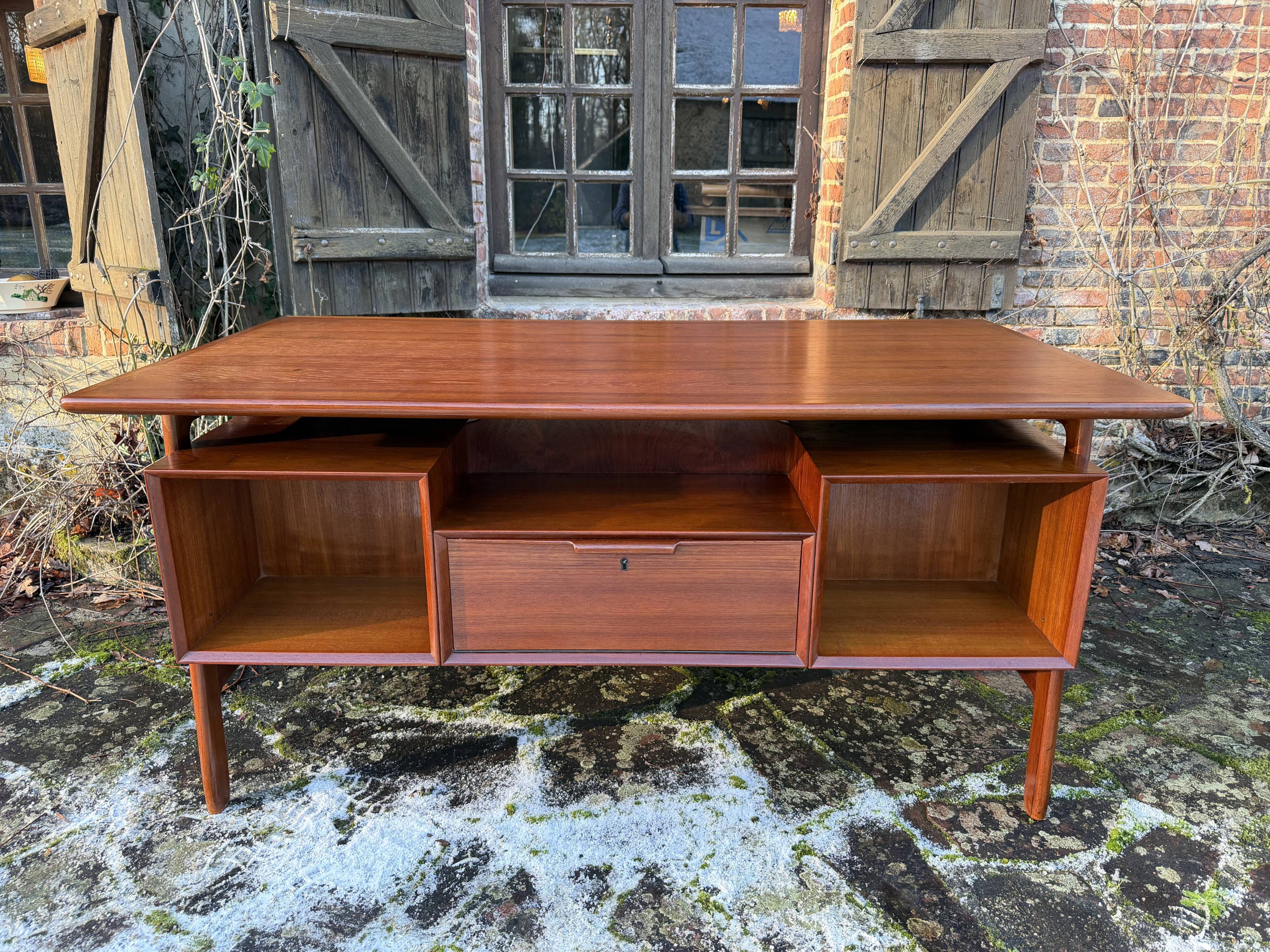 Danish teak desk Gunni Omann no. 75 from the 1960s.
