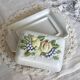 Large vintage earthenware and slip butter dish with fruit motif
