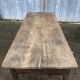 Antique farmhouse table in solid oak with tapered legs and 1 drawer at the end.