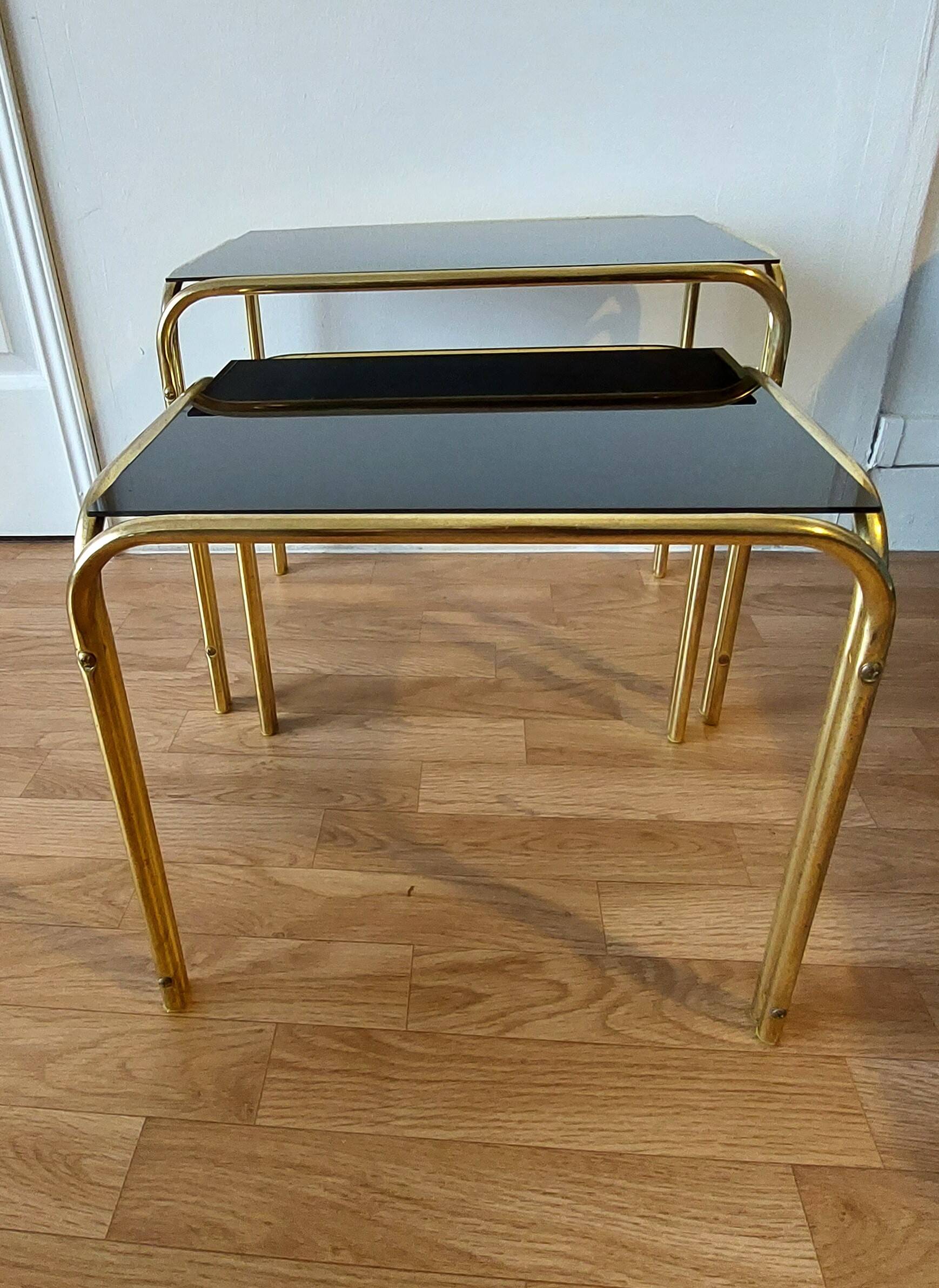 Vintage 1970 gold metal nesting tables.