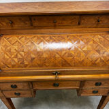 Cylinder desk with marquetry featuring a crosshatch design.