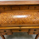 Cylinder desk with marquetry featuring a crosshatch design.