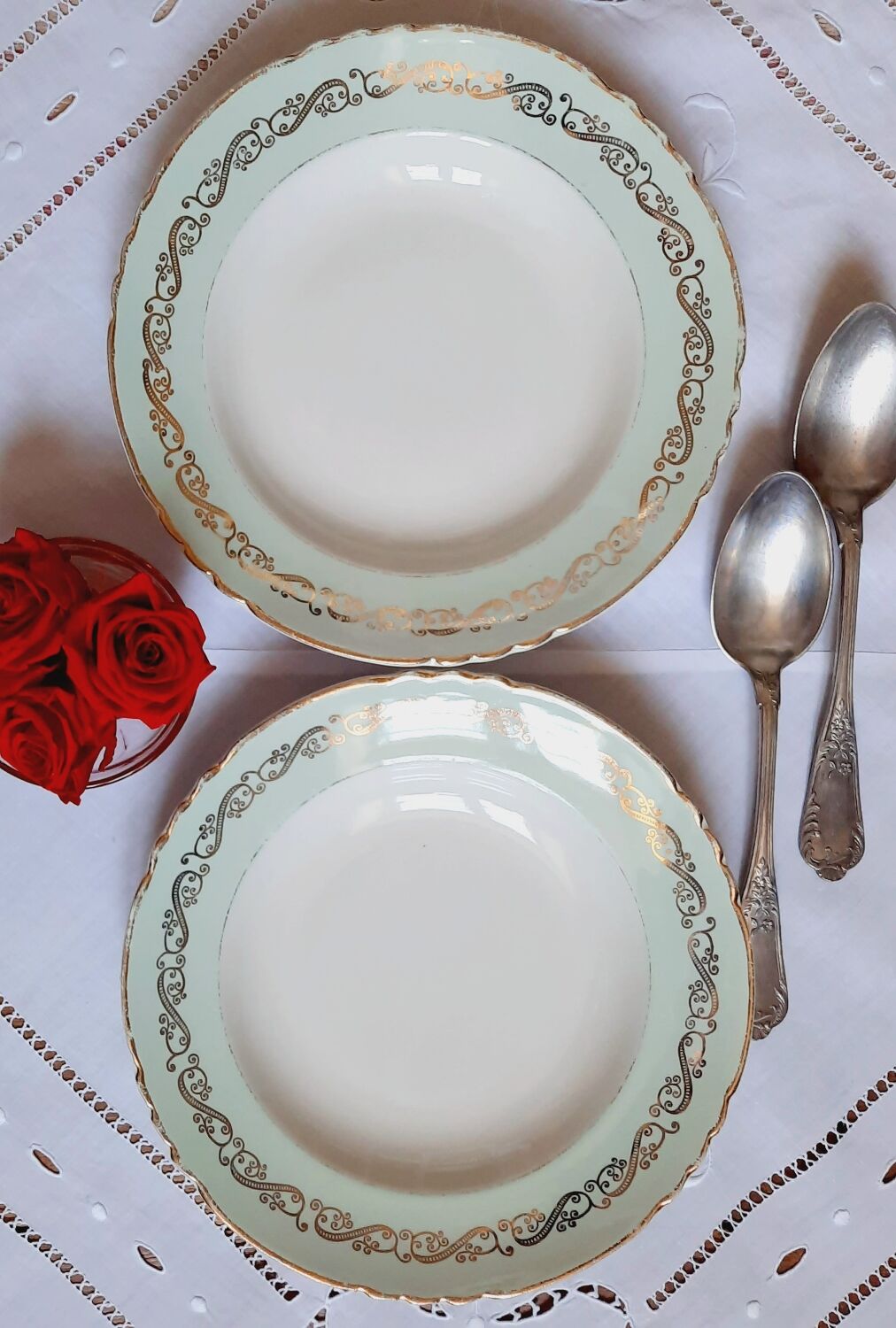 Old hollow plates mismatched in earthenware with gilded edges