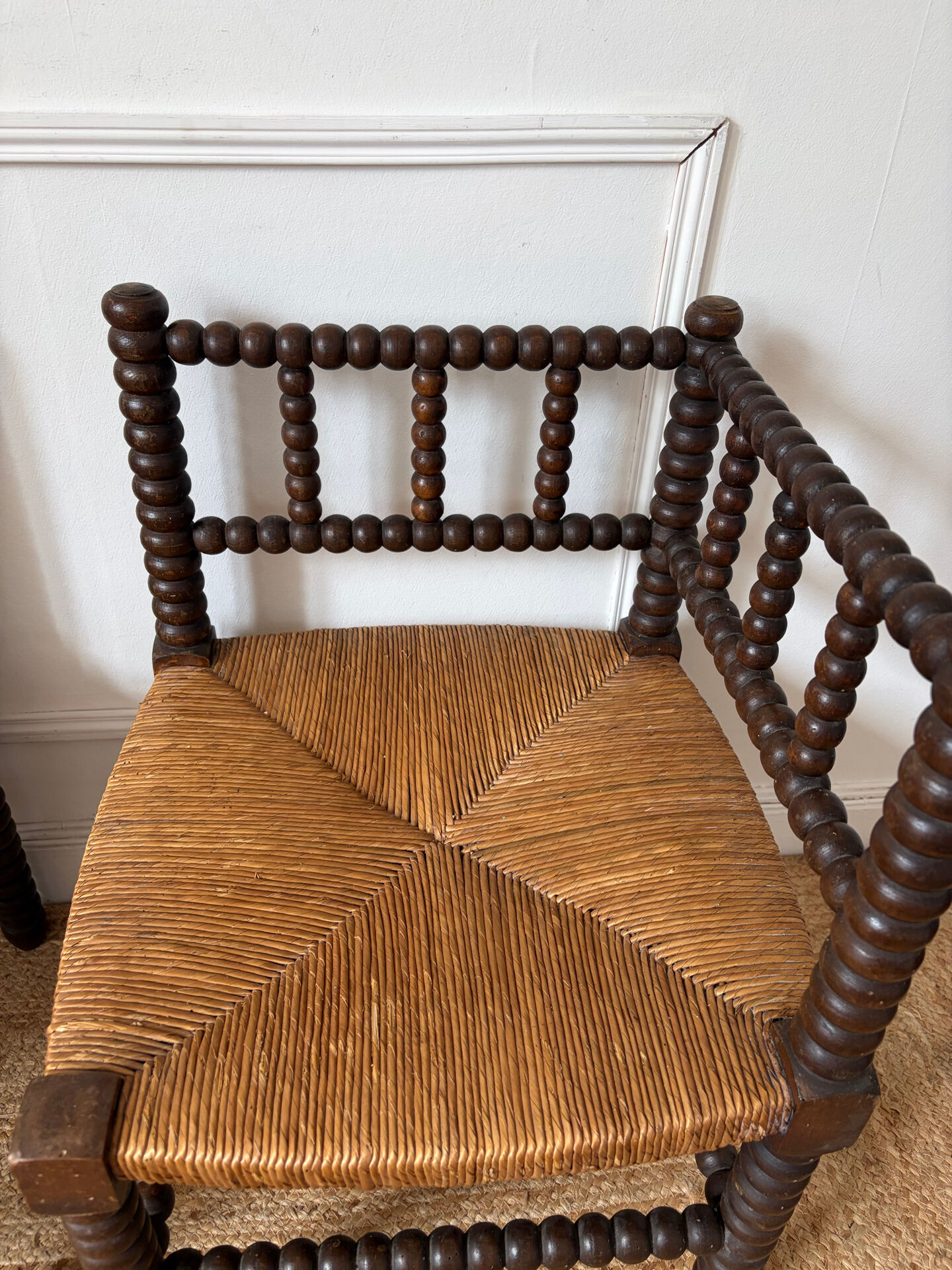 Pair of rush-seated chairs by the fireside "bobbin"
