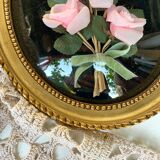 Oval frame domed glass curved roses
