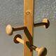 Modernist coat rack with 8 vintage 1980 hooks.