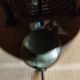 Old round porthole bull's eye wall clock in its wooden case + pendulum + key
