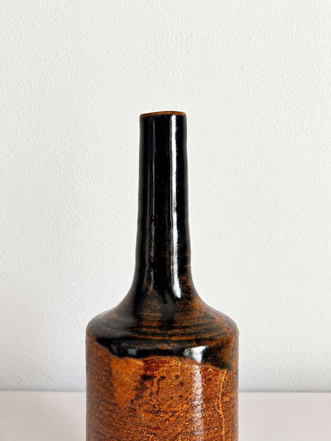 Brown and black glazed stoneware single flower vase, antique handmade pottery.