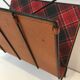 Magazine rack in black lacquered metal, leather and checkered fabric