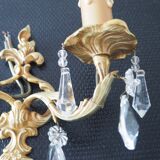 Pair of gilded bronze sconces and crystal pendants