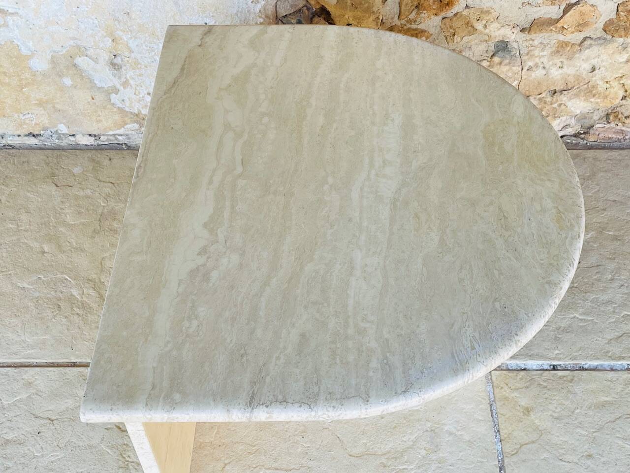 Vintage side table in travertine, circa 1980s.