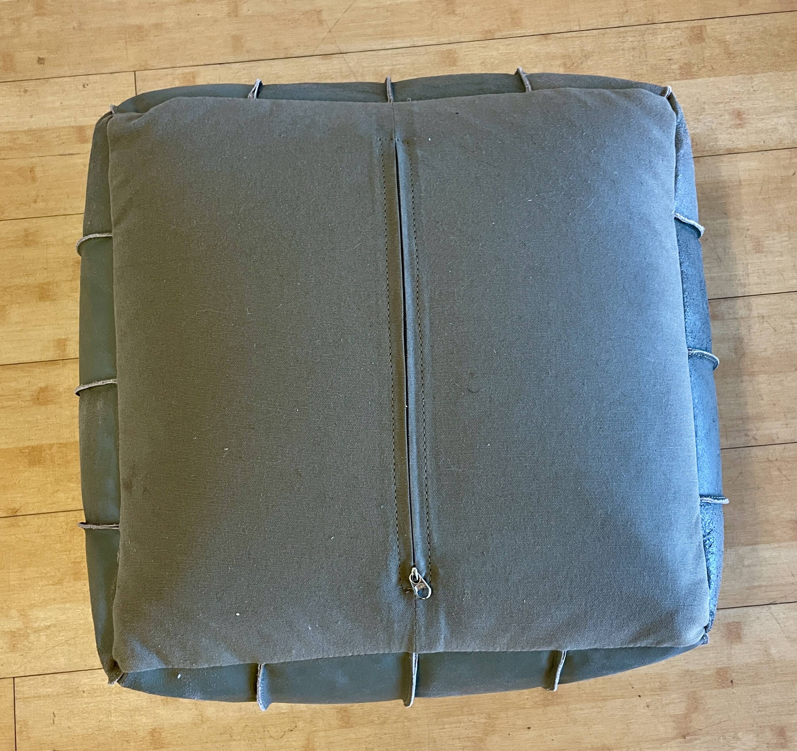 Grey leather pouf