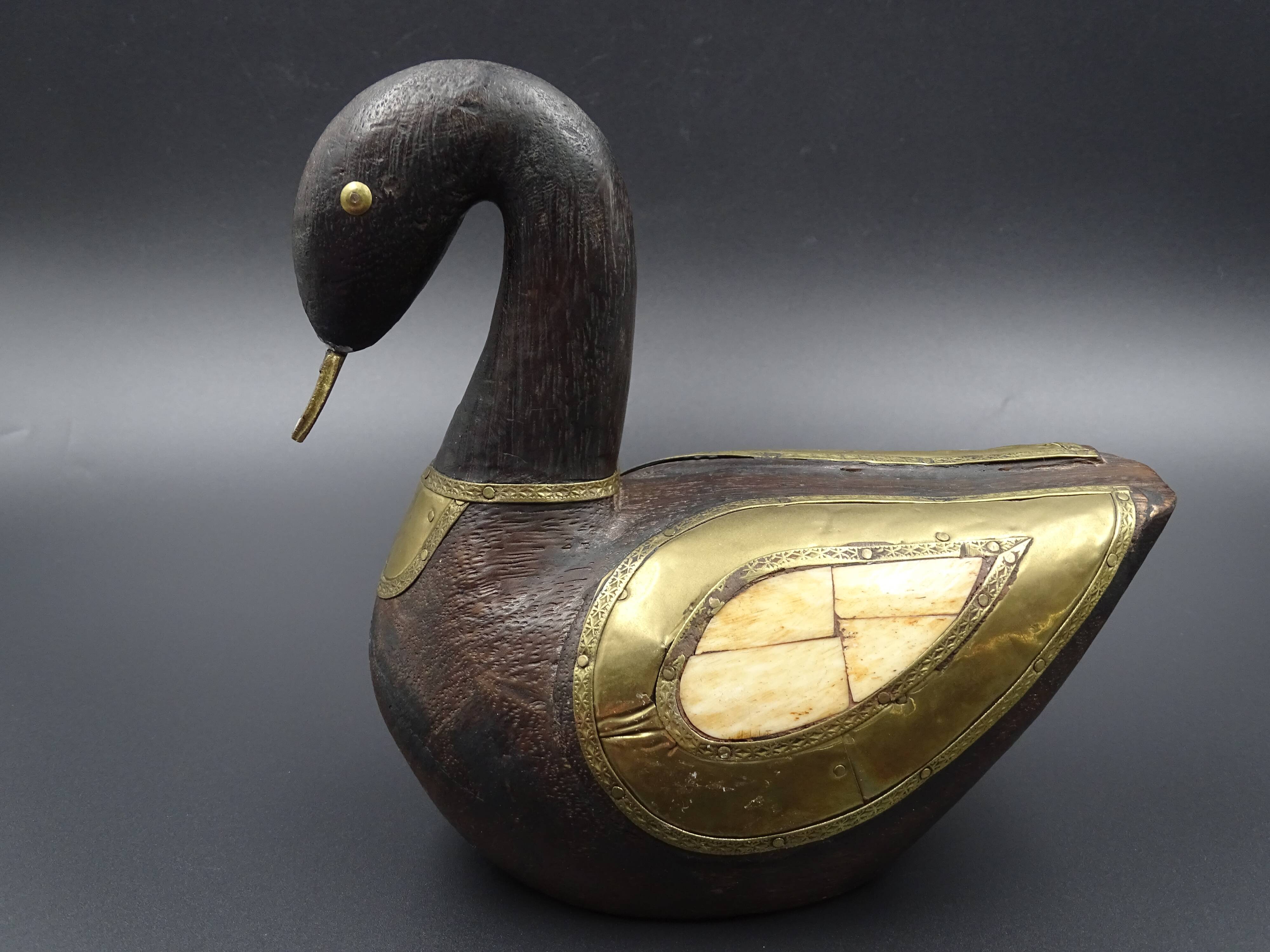 Wooden and brass swan