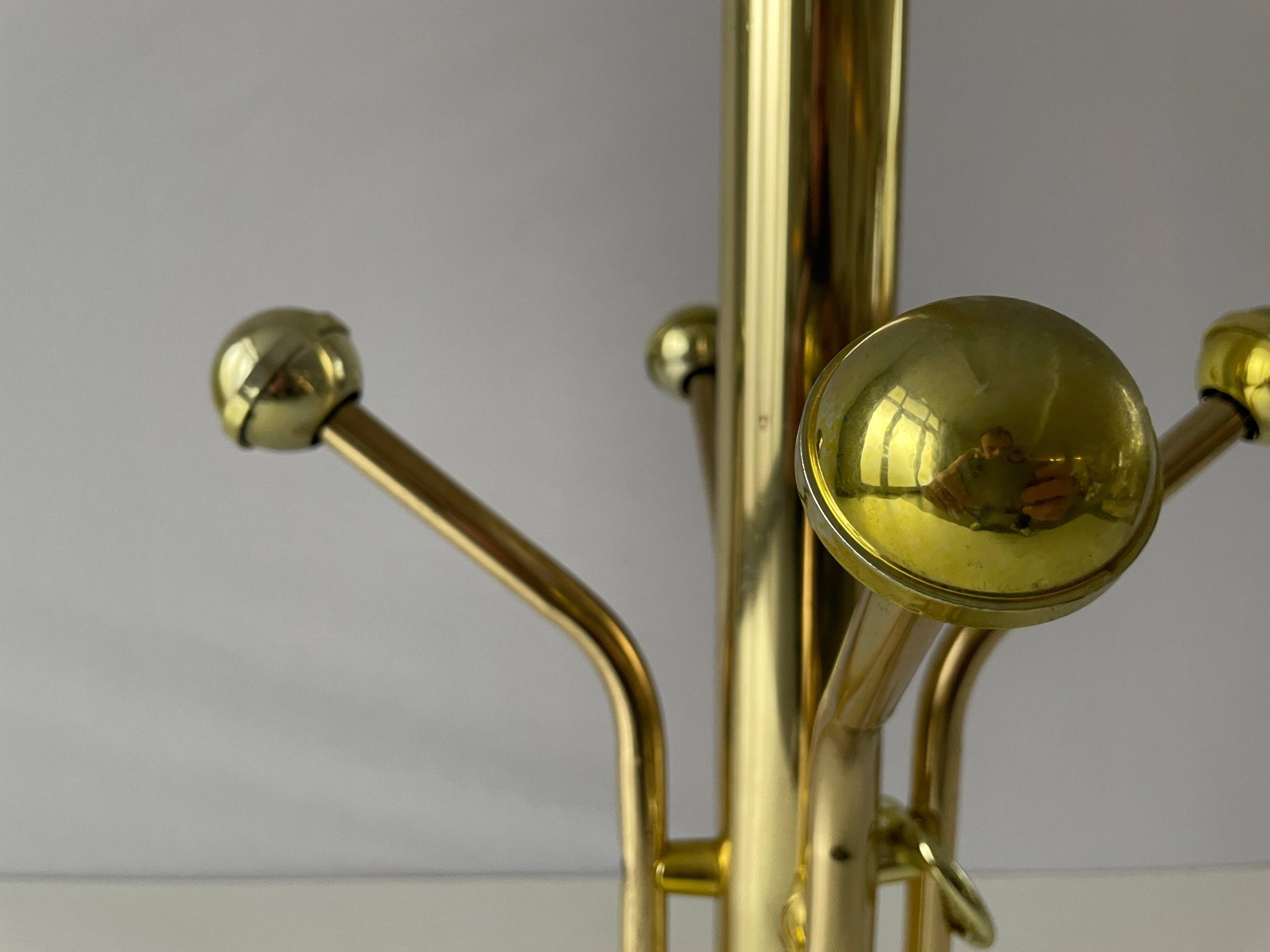 Free-standing coat rack in plexiglass with a marble base, 1960s, Germany.