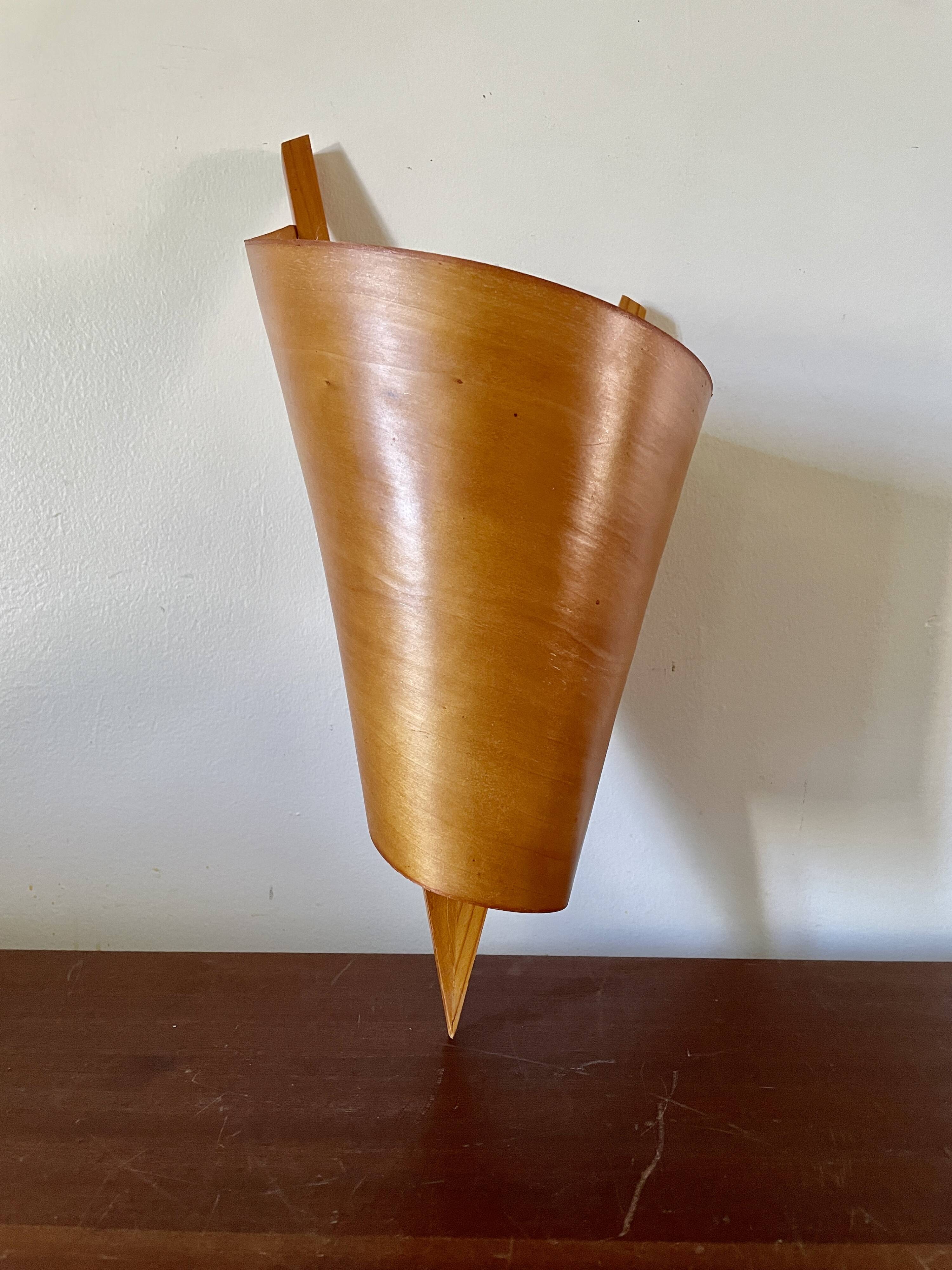Large wood veneer wall light on the right, 1980.