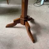 Antique round table with floral details.