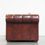 Luxurious and spacious two-seater sheepskin sofa of top quality with fabric cushions
