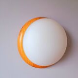 Wall light in pine and white opal.