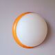 Wall light in pine and white opal.