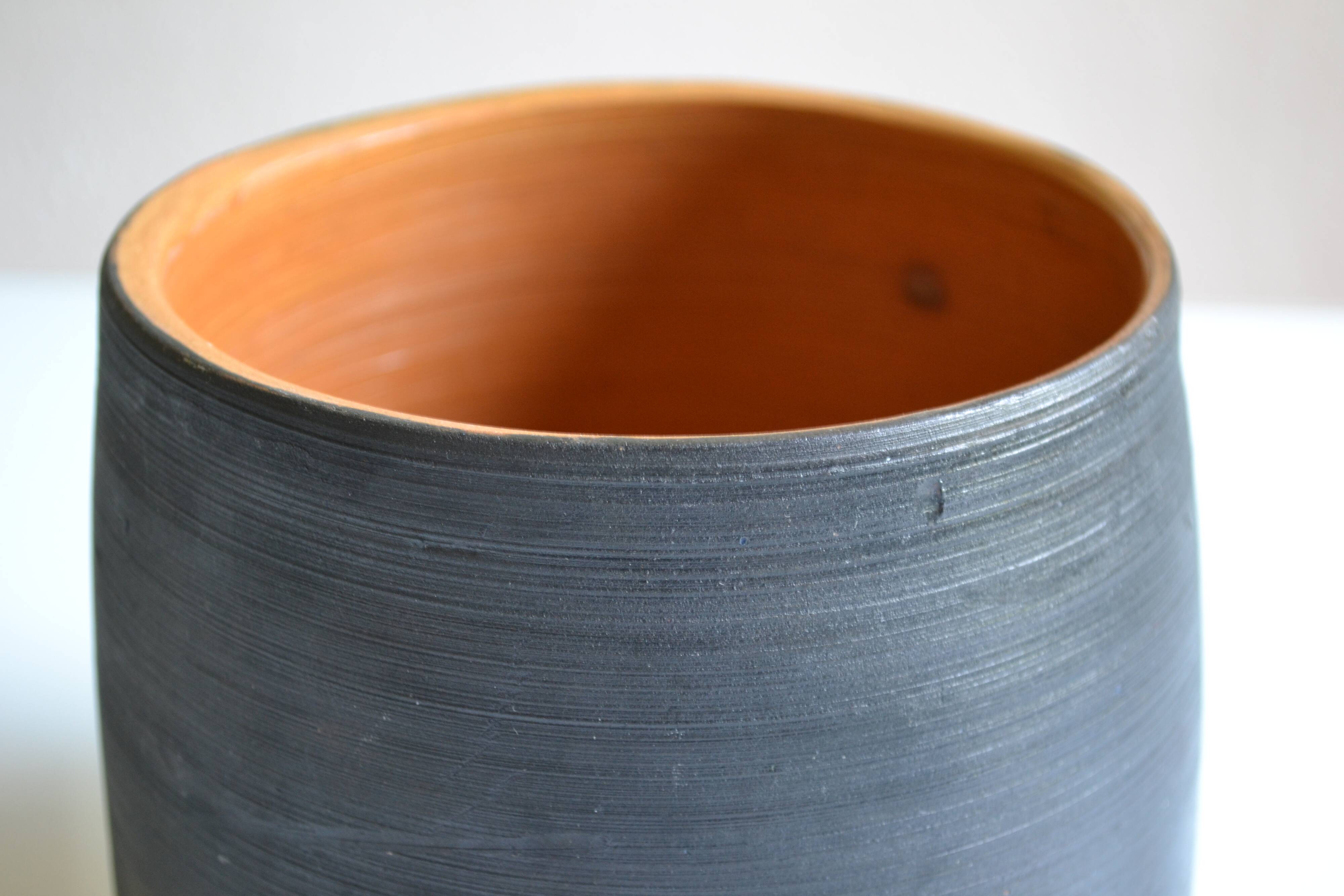 Ceramic cache pot or pocket emptying dish with a signature fish to identify.