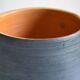 Ceramic cache pot or pocket emptying dish with a signature fish to identify.