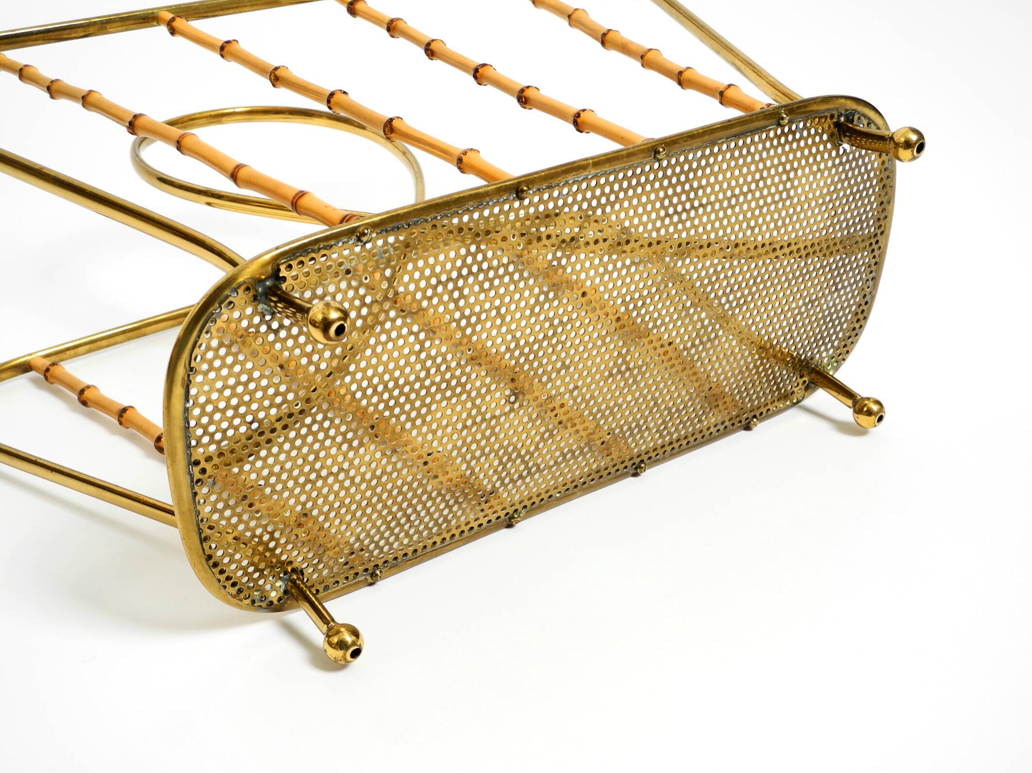 Rare Mid Century Modern magazine rack made of solid brass and genuine bambo