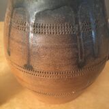Antique ceramic pitcher with drips and striated patterns gradients of chestnuts