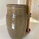 Old varnished stoneware pickle pot with tongs