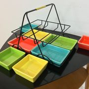 Black metal appetizer set with colorful ceramic ramekins
