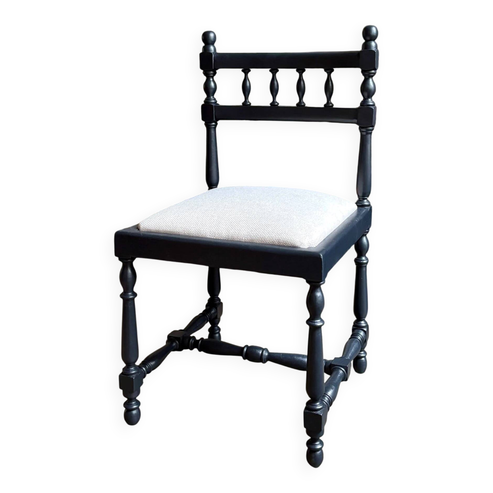 Black turned wooden chair and ivory cotton.