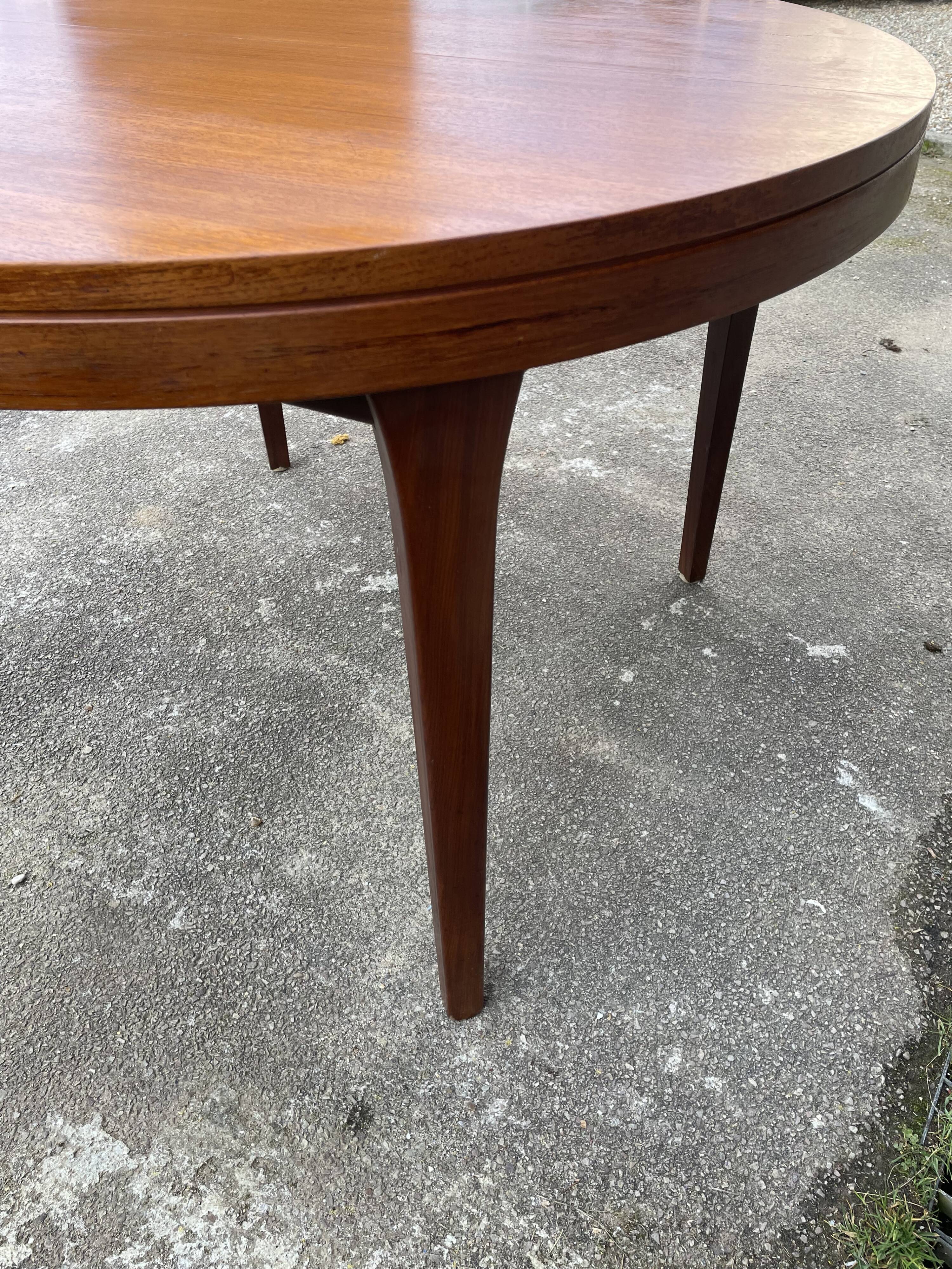 Round teak dining table