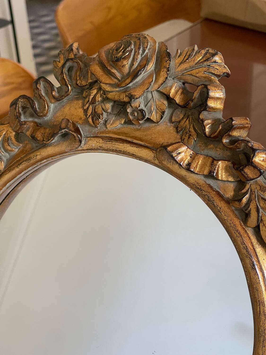 Round carved wooden mirror