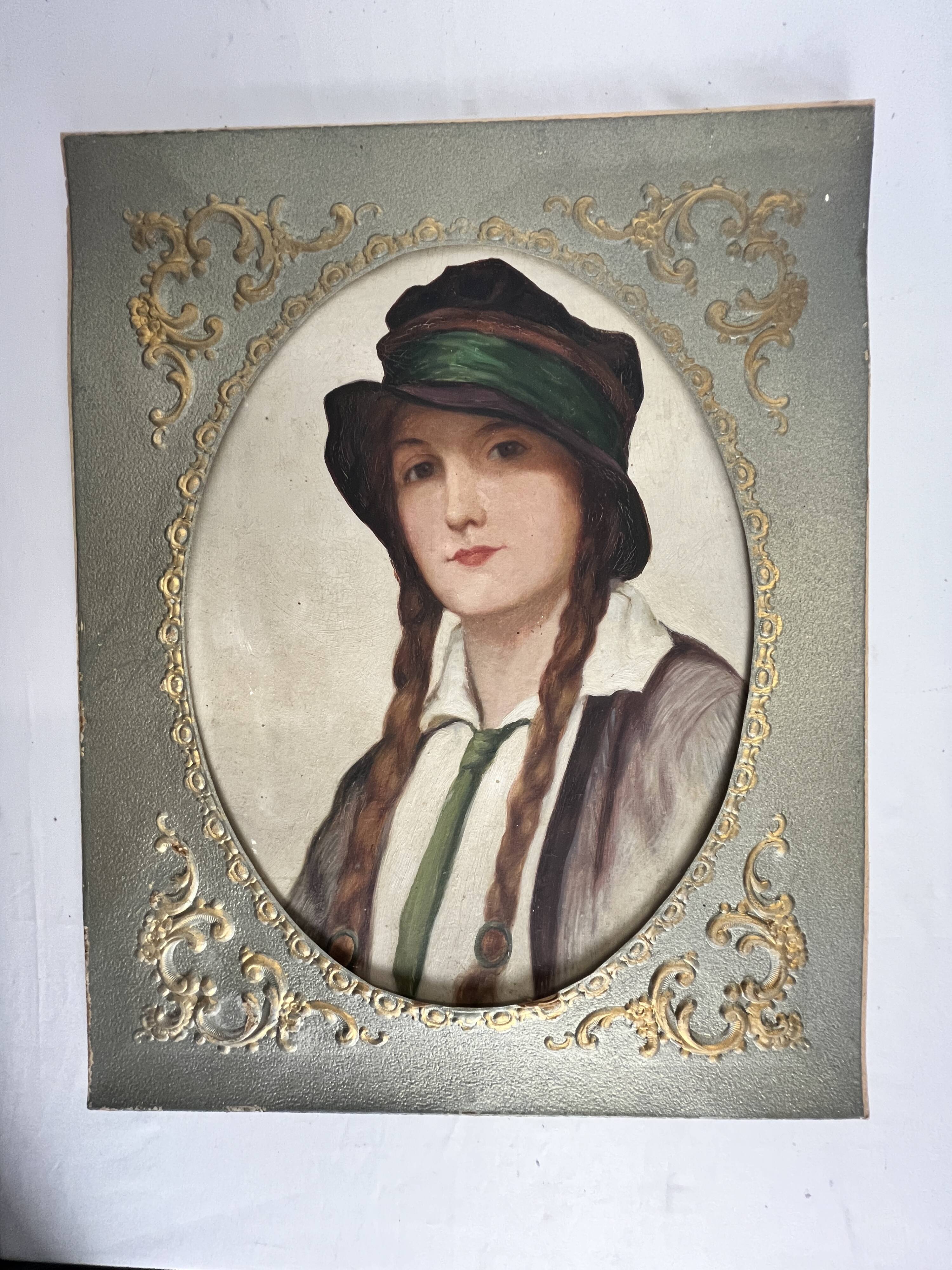 Old portrait of a young woman with braids and a hat, circa 1930