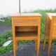 Pair of walnut bedside tables in Louis XVI style with brass inlay.