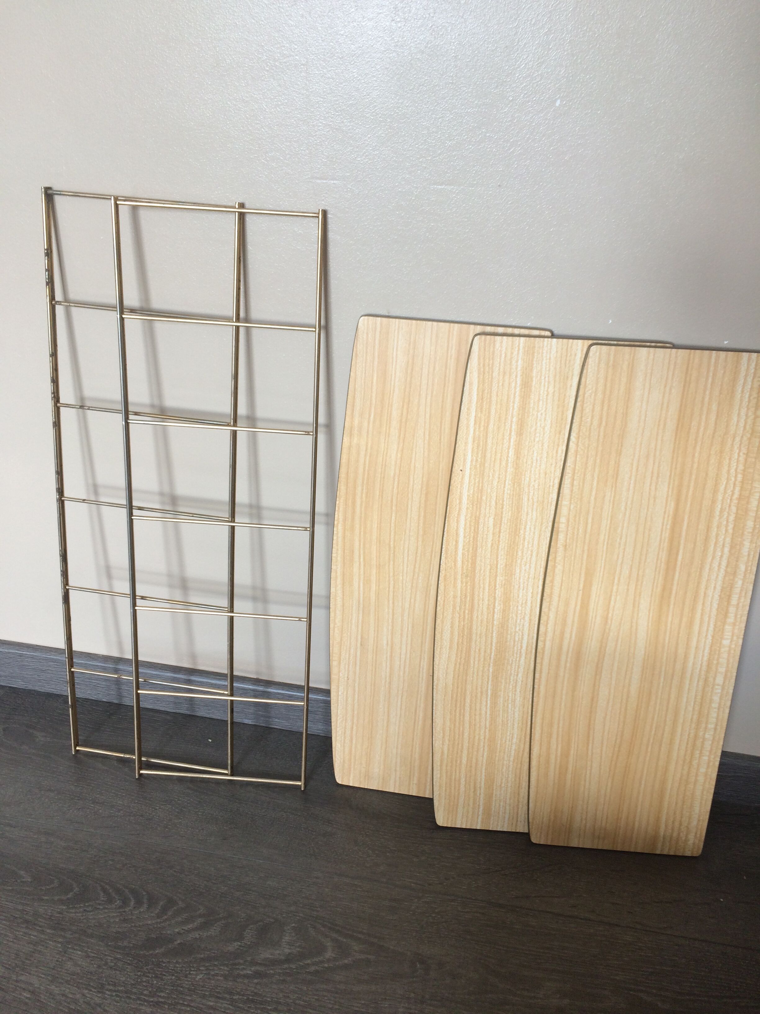 String shelf with wooden trays and formica