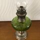 Antique oil lamp in glass and metal