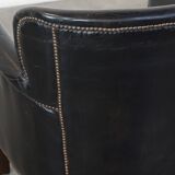 Subtle black armchair with reversible Kelim seat cushion