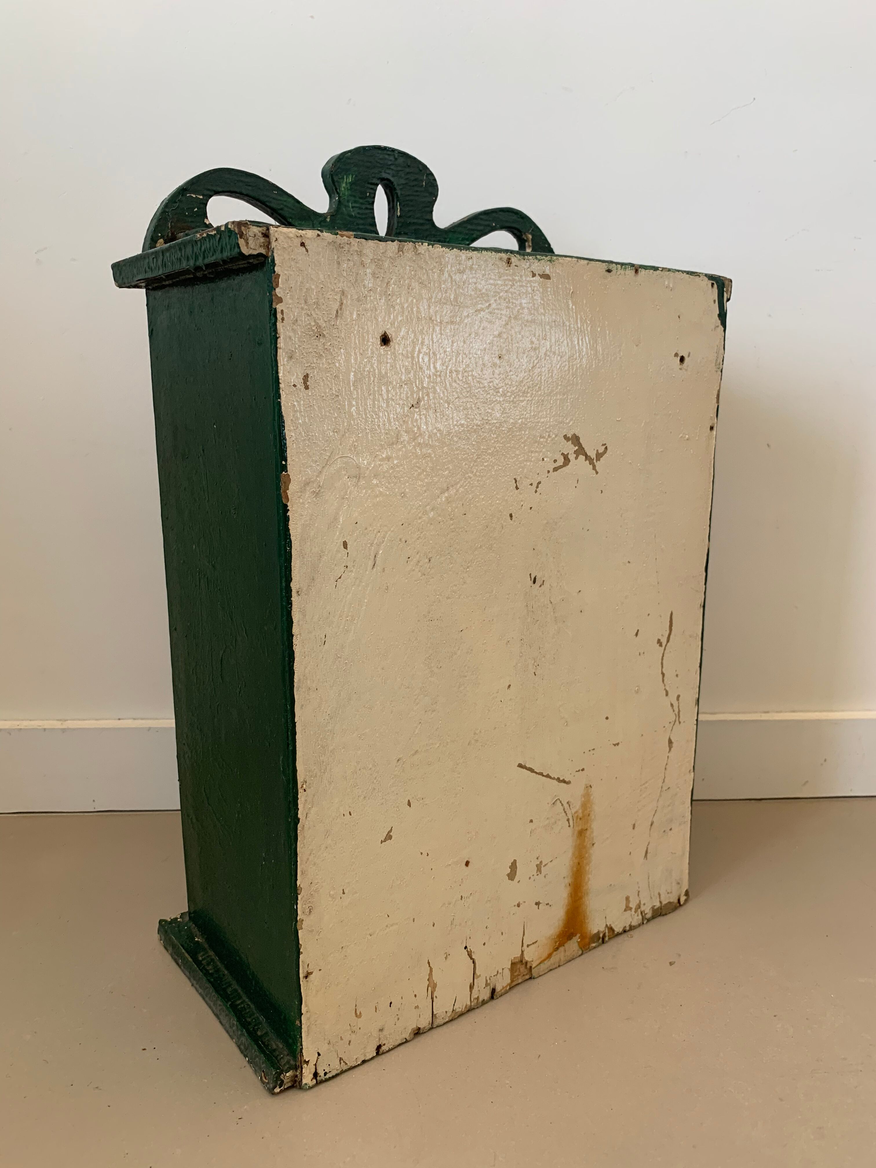 Wall vitrin with pediment