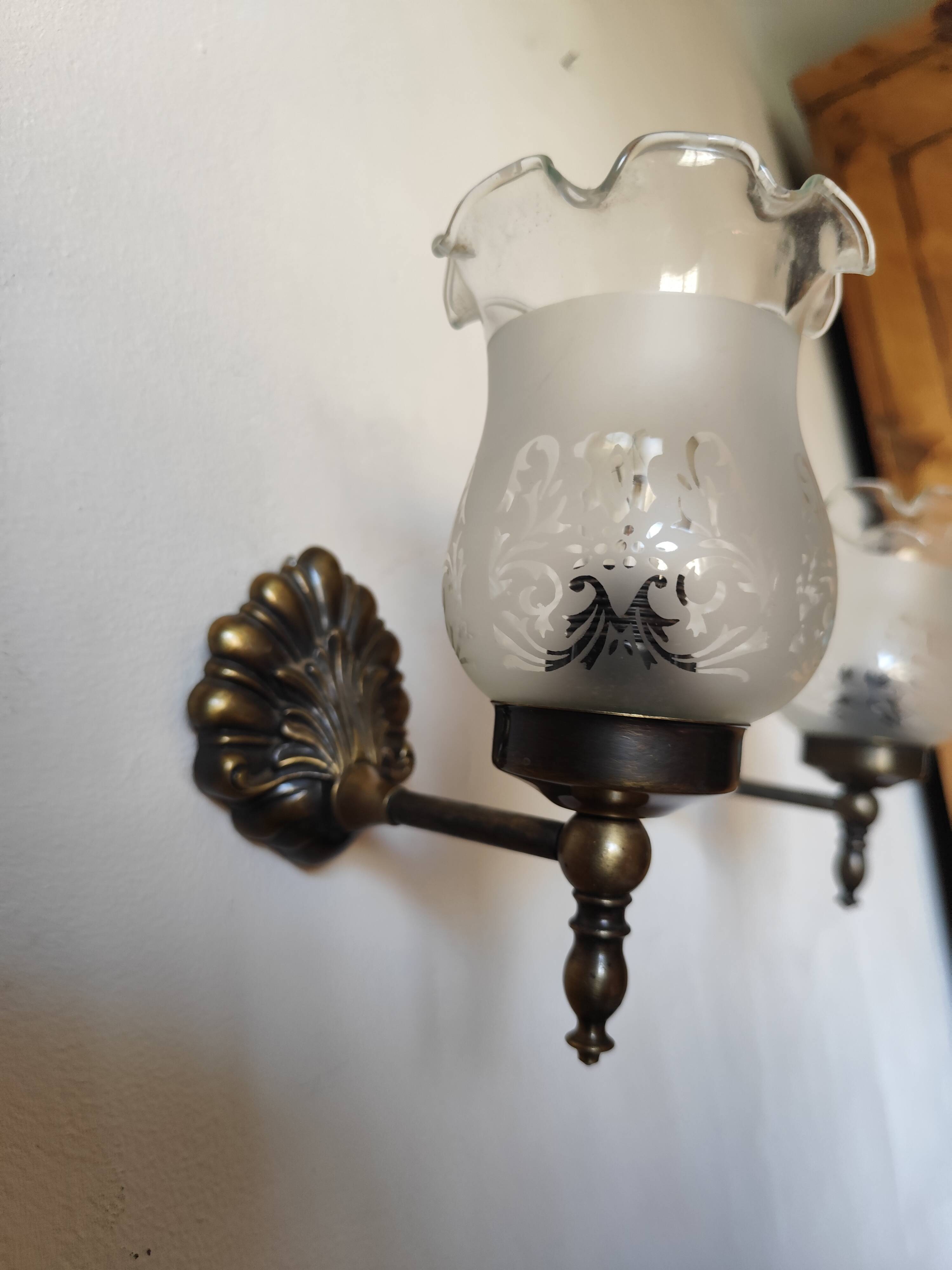 Pair of wall sconces in bronze with opaline glass tulips.