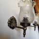 Pair of wall sconces in bronze with opaline glass tulips.