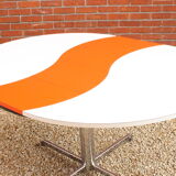 Ying-Yang round orange extendable dining table, 1970s.