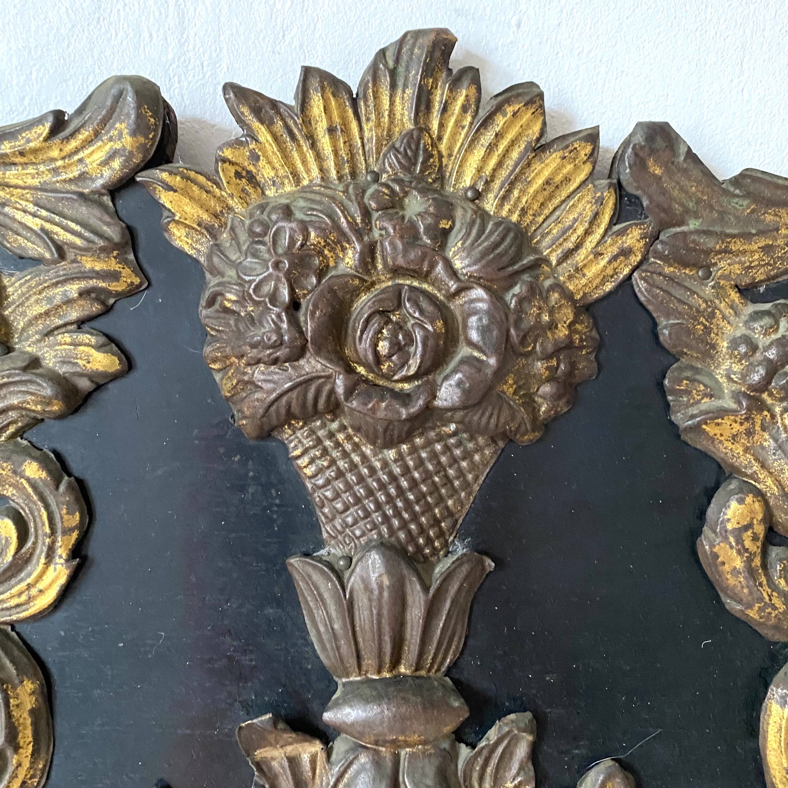 Pediment in blackened wood and 19th century embossed gilded metal foil