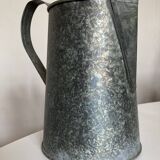 Old garden pitcher vase in folded zinc