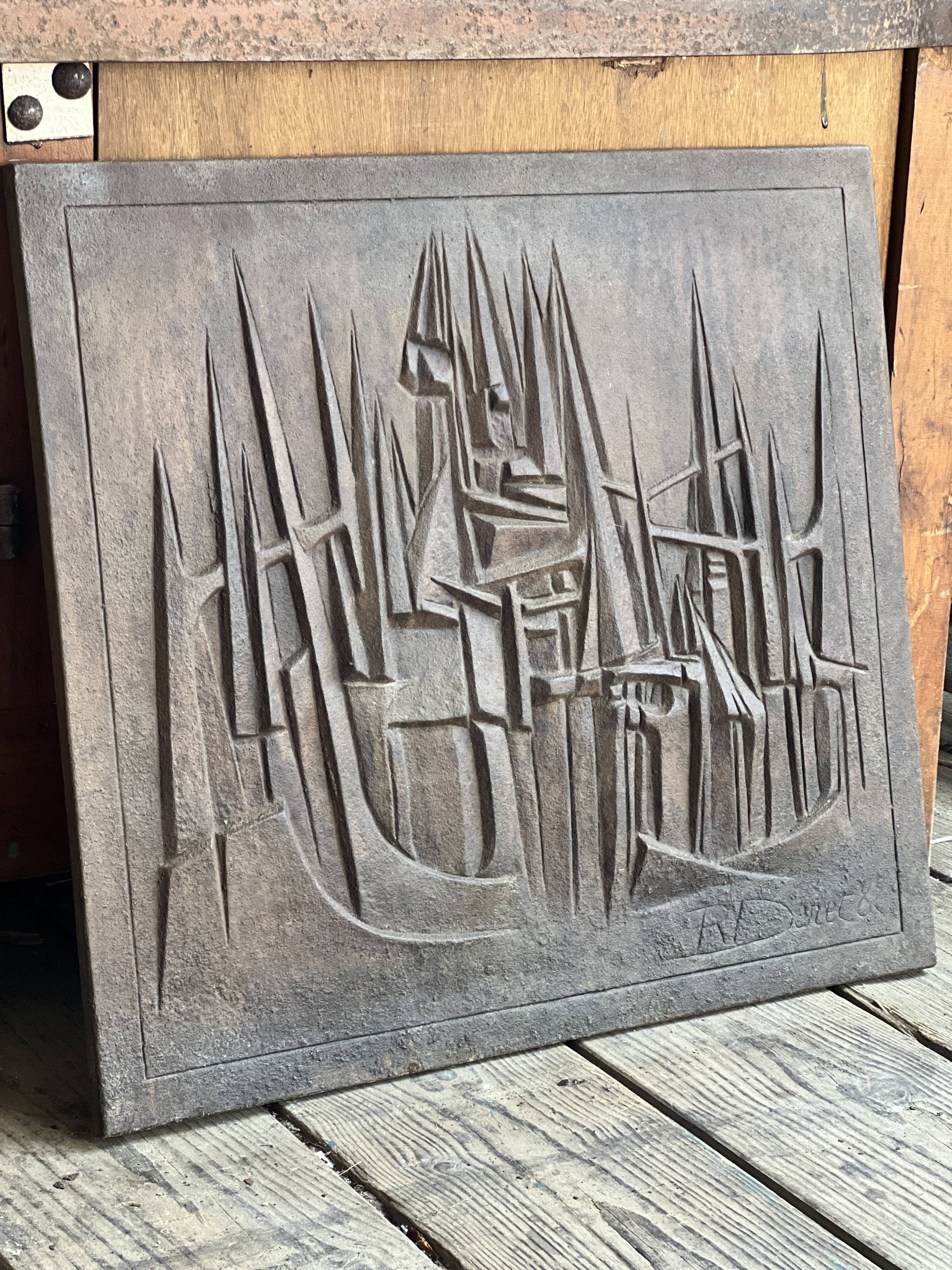 Cast iron plaque signed