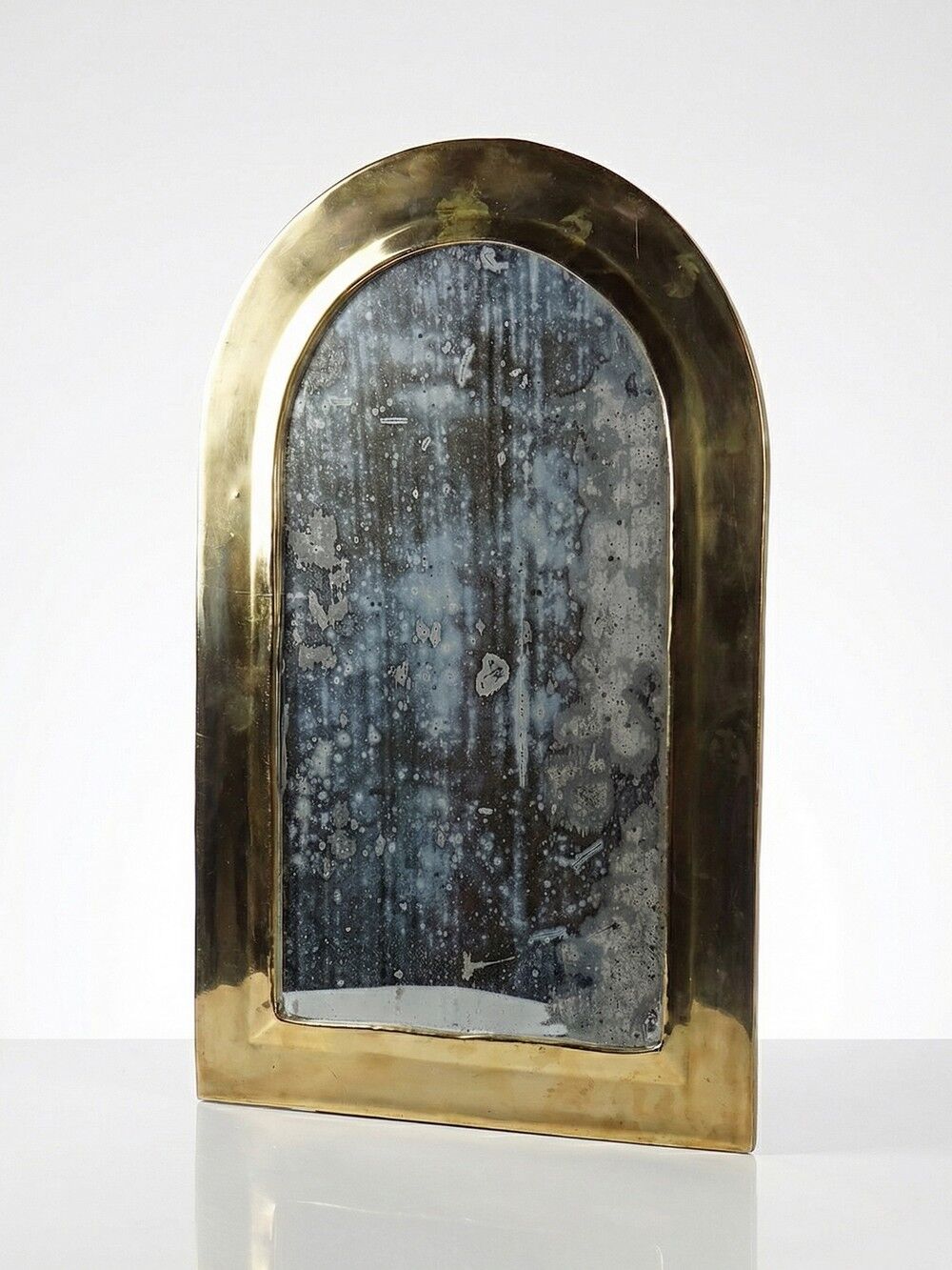 Large vintage Moroccan artisan wall mirror from the 50s-70s, made of solid brass, arch-shaped.