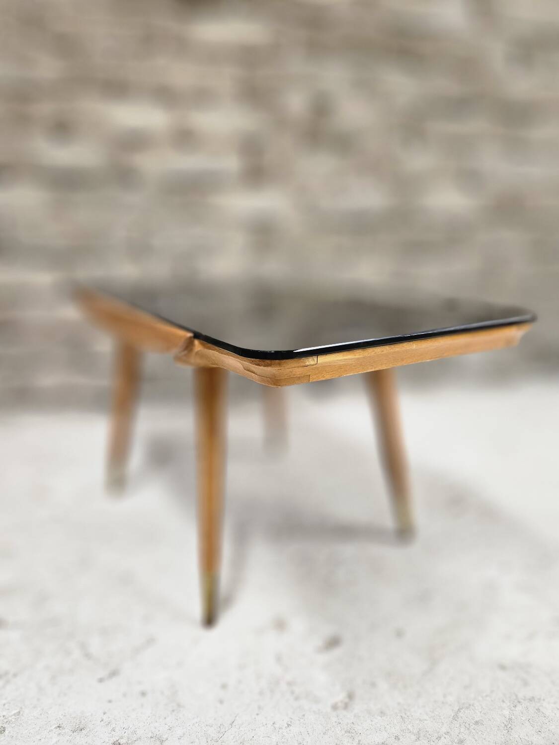 Small opaque black glass coffee table 1960