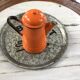 Orange and black enamelled sheet metal coffee maker