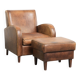 Set of a sheepskin armchair and ottoman finished with matching piping