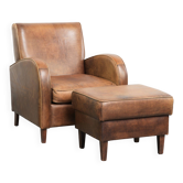 Set of a sheepskin armchair and ottoman finished with matching piping
